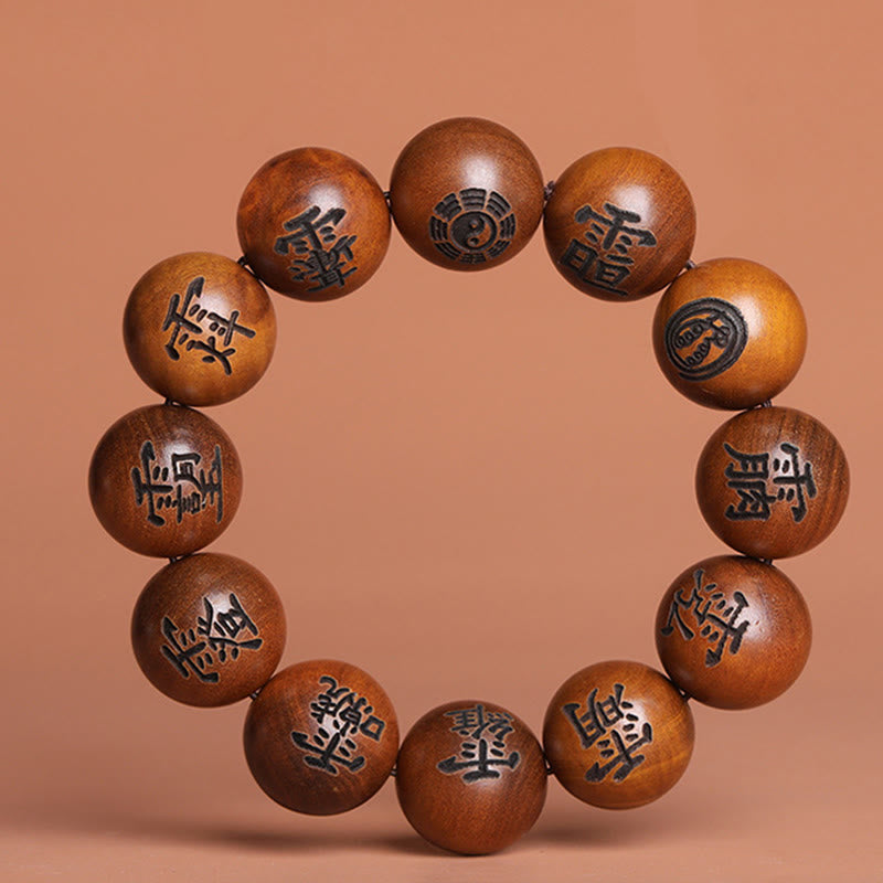Buddha Stones Fulmine Colpito Legno di Giuggiola Yin Yang Bagua Caratteri Tabù Taoisti Braccialetto di Protezione Inciso