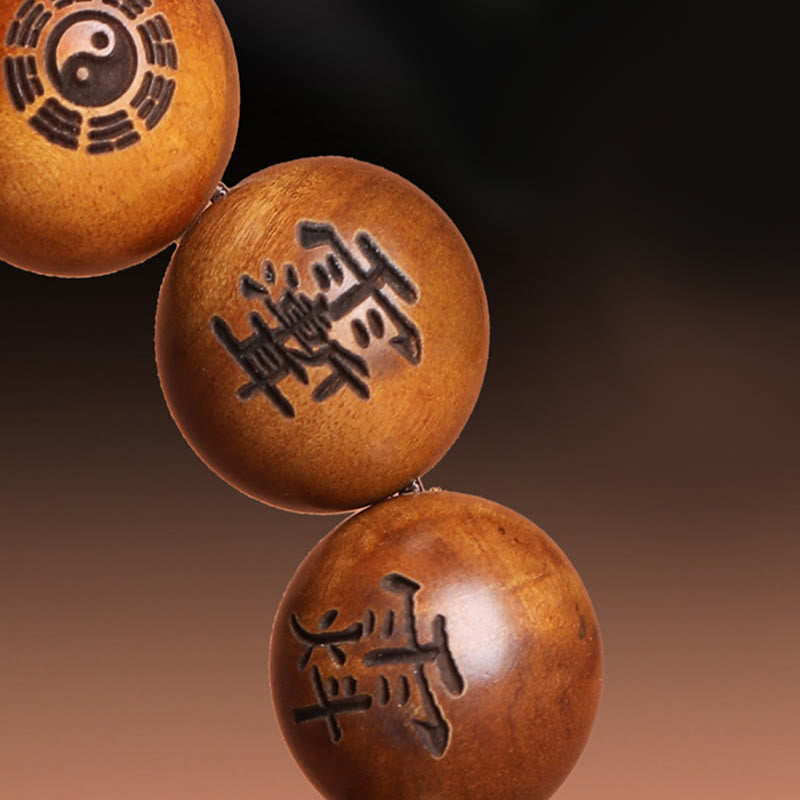 Buddha Stones Fulmine Colpito Legno di Giuggiola Yin Yang Bagua Caratteri Tabù Taoisti Braccialetto di Protezione Inciso