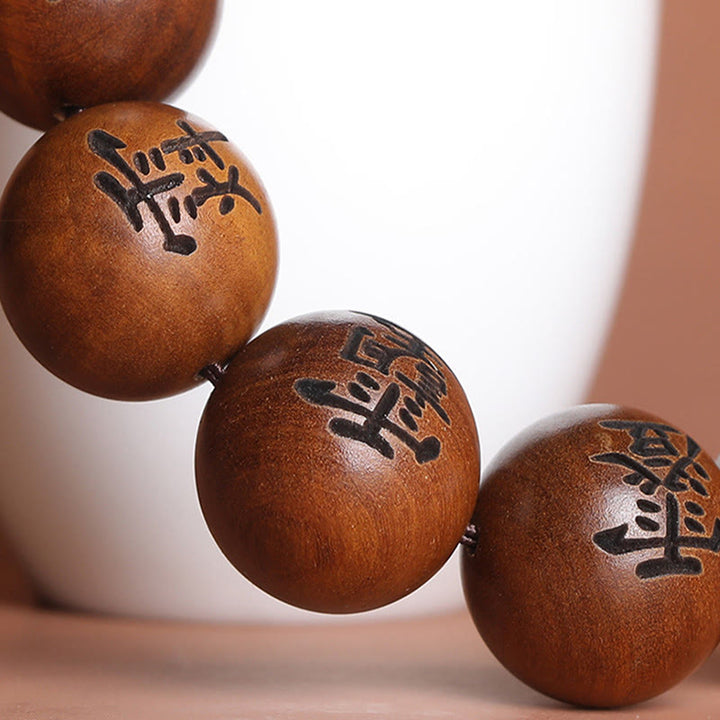 Buddha Stones Fulmine Colpito Legno di Giuggiola Yin Yang Bagua Caratteri Tabù Taoisti Braccialetto di Protezione Inciso