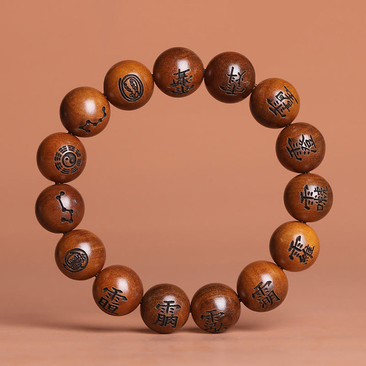 Buddha Stones Fulmine Colpito Legno di Giuggiola Yin Yang Bagua Caratteri Tabù Taoisti Braccialetto di Protezione Inciso