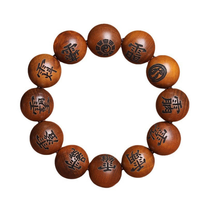 Buddha Stones Fulmine Colpito Legno di Giuggiola Yin Yang Bagua Caratteri Tabù Taoisti Braccialetto di Protezione Inciso