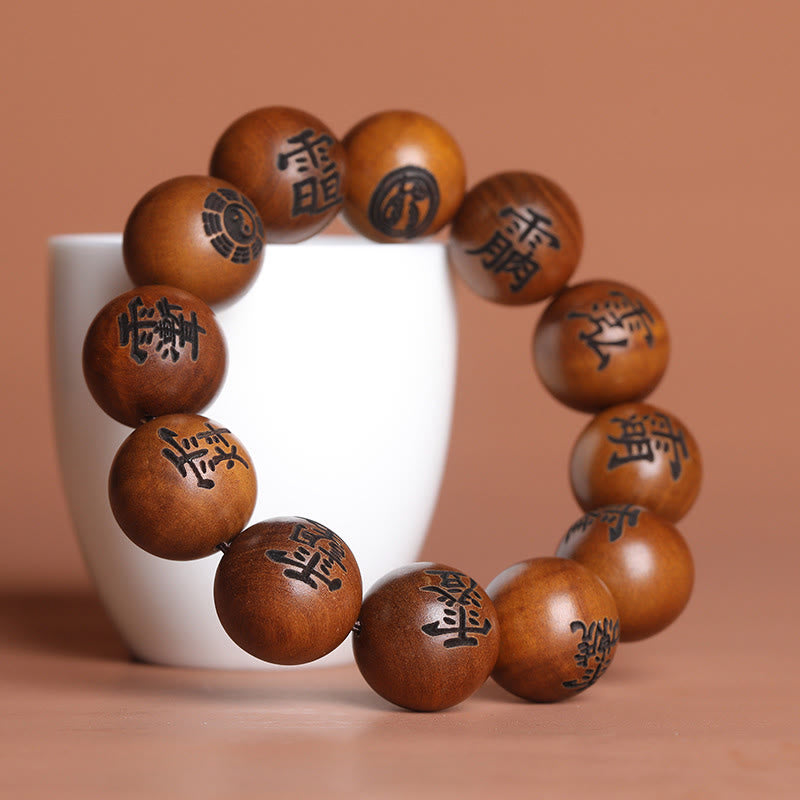Buddha Stones Fulmine Colpito Legno di Giuggiola Yin Yang Bagua Caratteri Tabù Taoisti Braccialetto di Protezione Inciso