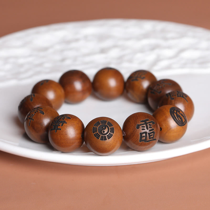 Buddha Stones Fulmine Colpito Legno di Giuggiola Yin Yang Bagua Caratteri Tabù Taoisti Braccialetto di Protezione Inciso
