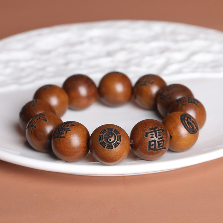 Buddha Stones Fulmine Colpito Legno di Giuggiola Yin Yang Bagua Caratteri Tabù Taoisti Braccialetto di Protezione Inciso
