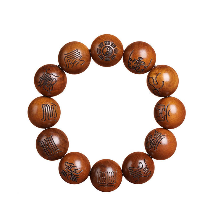 Buddha Stones Fulmine Colpito Legno di Giuggiola Yin Yang Bagua Taoista Tabù Scrittura Simbolo Braccialetto della Fortuna Inciso