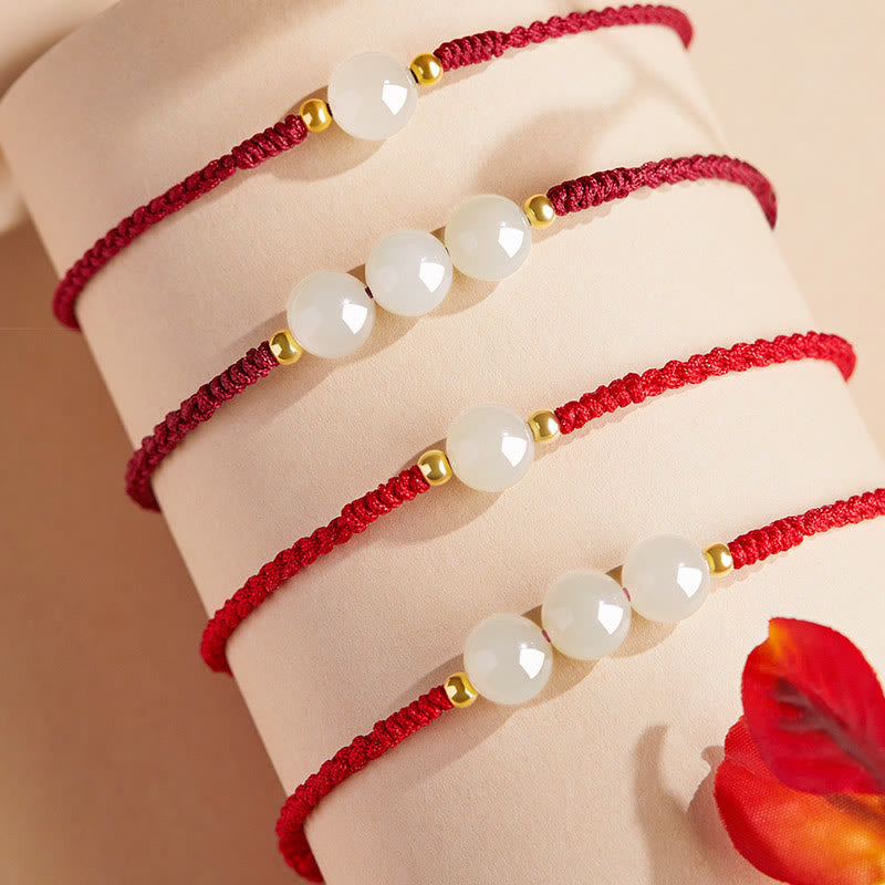 Bracciale intrecciato con perline di giada rotonde fatte a mano con Buddha Stones e portafortuna