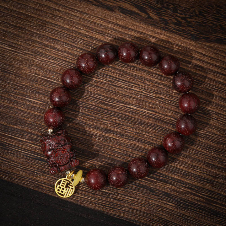 Braccialetto Buddha Stones Piccola Foglia Sandalo Rosso Oro Bestia Deglutitrice Calma