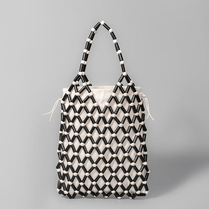 Borsa a mano con perline di legno cave intrecciate a mano in Buddha Stones