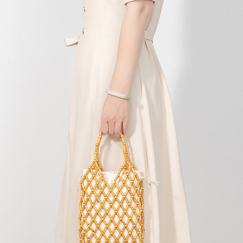 Borsa a mano con perline di legno cave intrecciate a mano in Buddha Stones