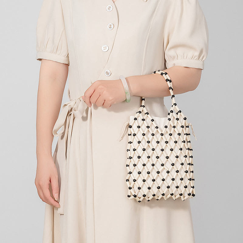 Borsa a mano con perline di legno cave intrecciate a mano in Buddha Stones