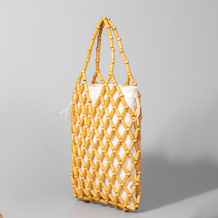 Borsa a mano con perline di legno cave intrecciate a mano in Buddha Stones