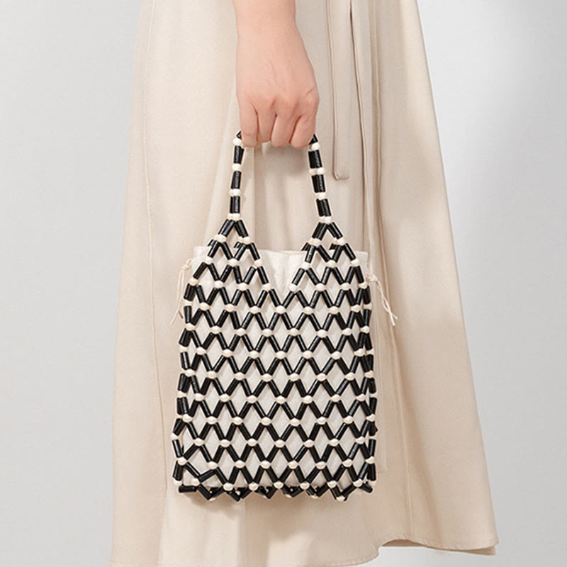 Borsa a mano con perline di legno cave intrecciate a mano in Buddha Stones