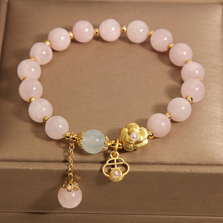 Braccialetto di calore con fiore portafortuna in cristallo rosa naturale Buddha Stones