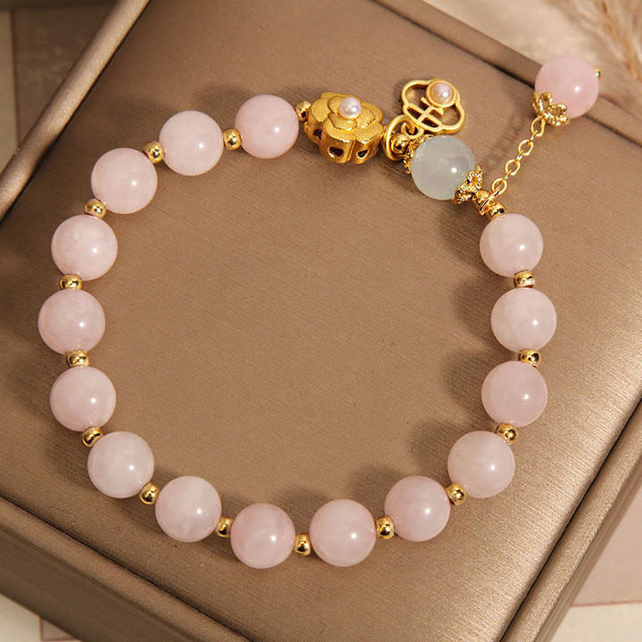 Braccialetto di calore con fiore portafortuna in cristallo rosa naturale Buddha Stones