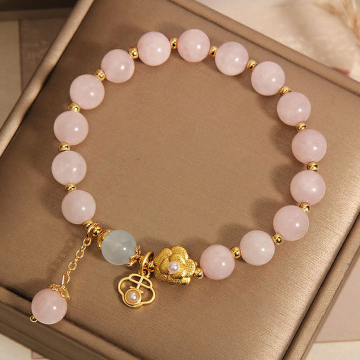 Braccialetto di calore con fiore portafortuna in cristallo rosa naturale Buddha Stones