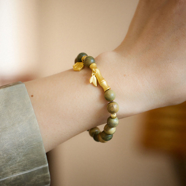 Braccialetto rilassante in bambù con carattere Fu in legno di sandalo verde Buddha Stones