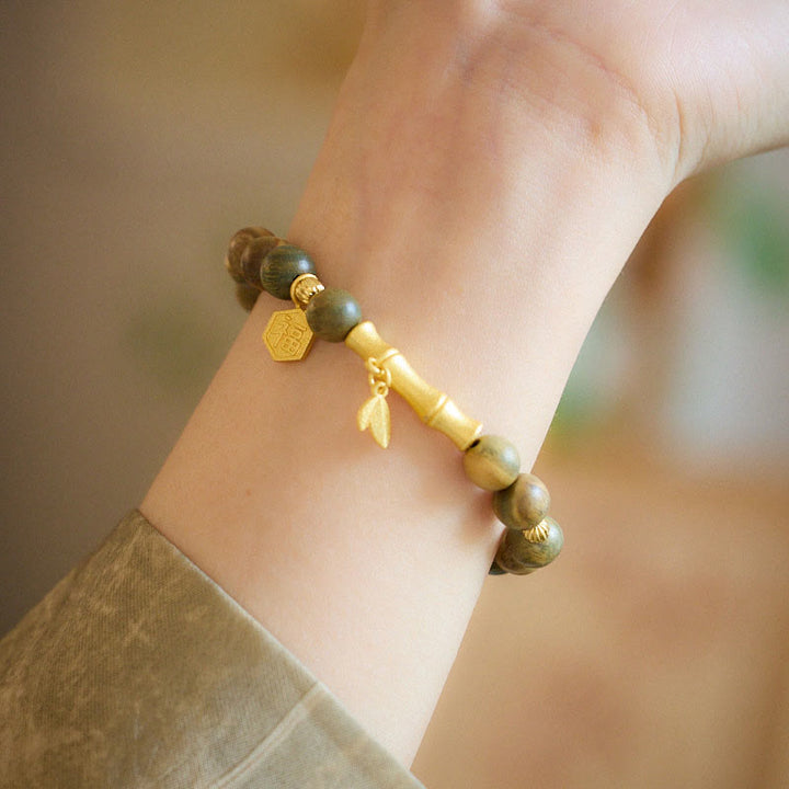 Braccialetto rilassante in bambù con carattere Fu in legno di sandalo verde Buddha Stones