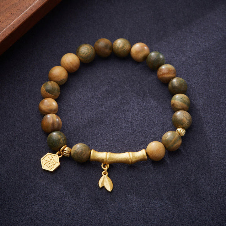 Braccialetto rilassante in bambù con carattere Fu in legno di sandalo verde Buddha Stones