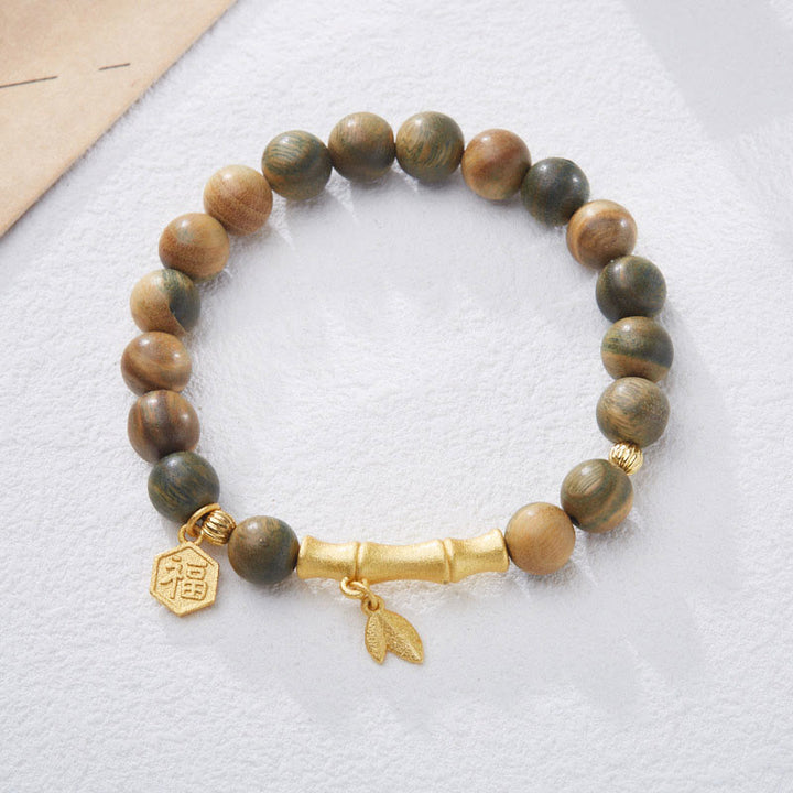 Braccialetto rilassante in bambù con carattere Fu in legno di sandalo verde Buddha Stones