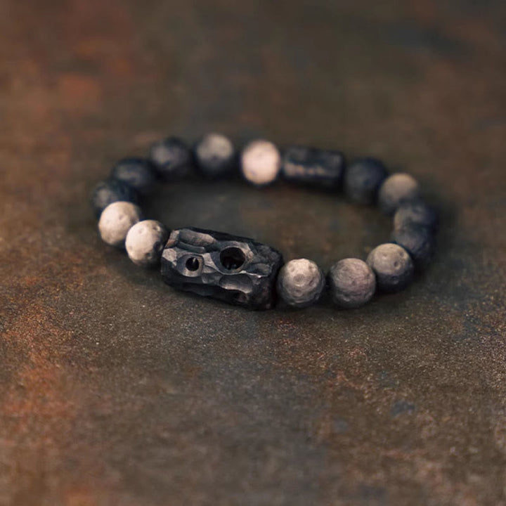 Braccialetto rilassante in legno di ebano e ossidiana con Buddha Stones in argento lucido