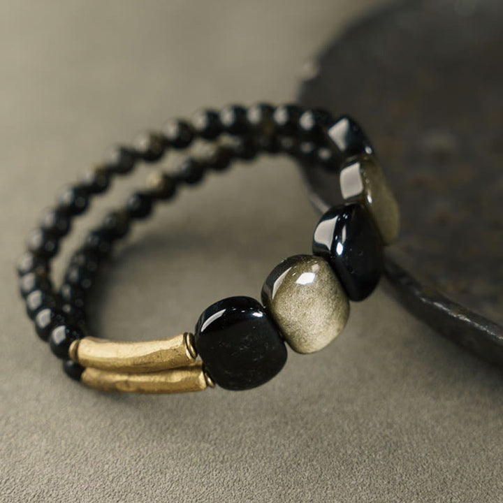 Braccialetto rinforzante in ossidiana nera e oro lucido Buddha Stones