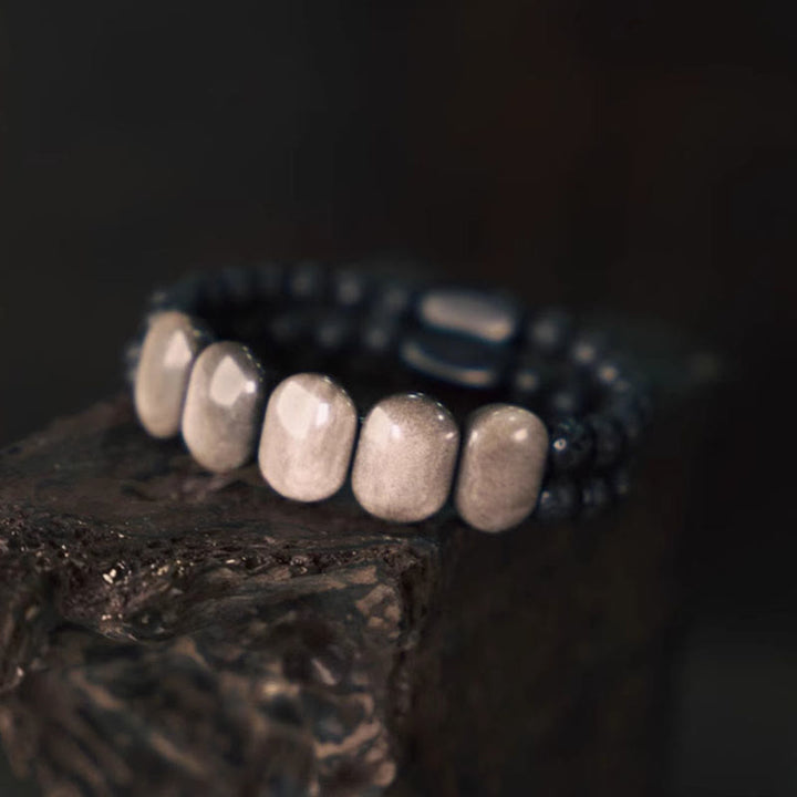 Braccialetto di comunicazione in pietra lavica con ossidiana e argento naturale Buddha Stones