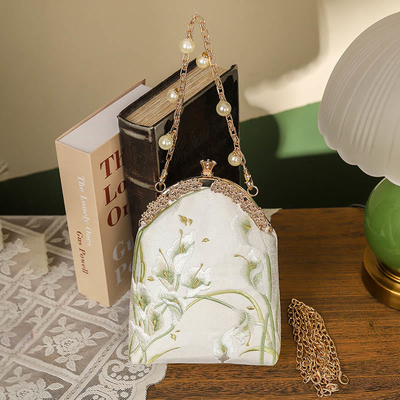 Borsa a tracolla con manico in metallo e ricamo Calla Buddha Stones