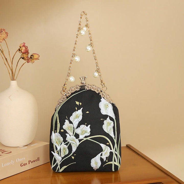 Borsa a tracolla con manico in metallo e ricamo Calla Buddha Stones