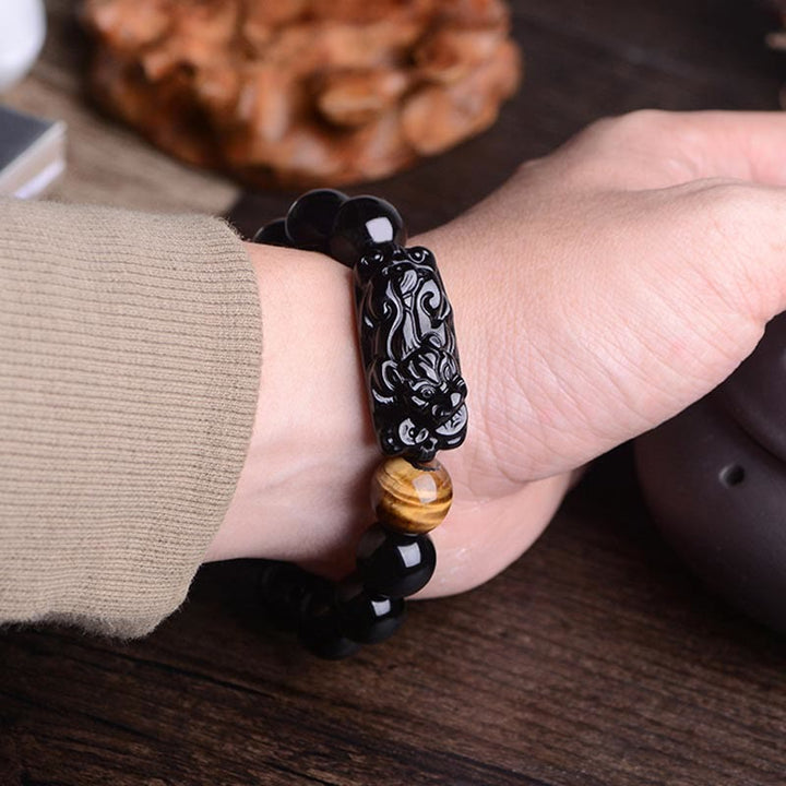 Braccialetto Buddha Stones in ossidiana nera naturale PiXiu Tiger's Eye Strength