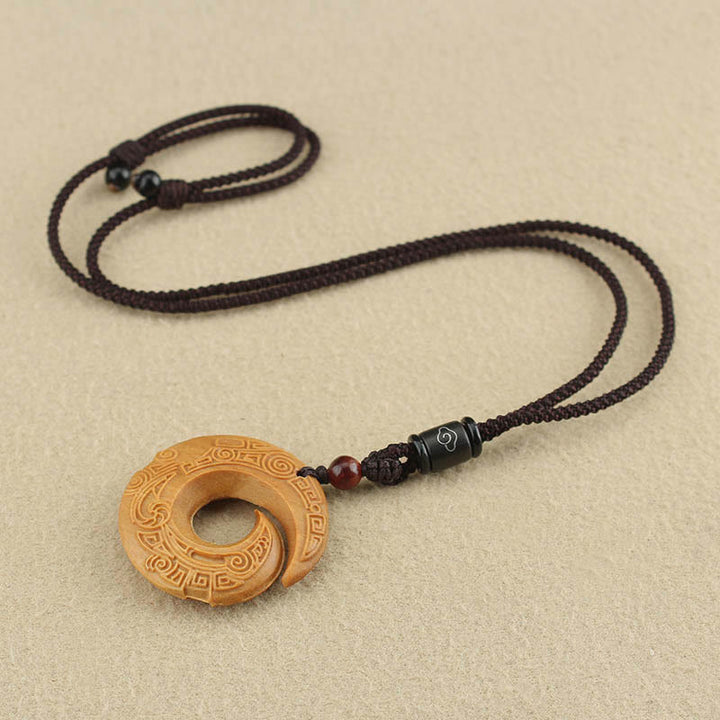 Buddha Stones Legno di ebano Sandalo La fortuna di una persona migliora Modello di design Collana con ciondolo di pace