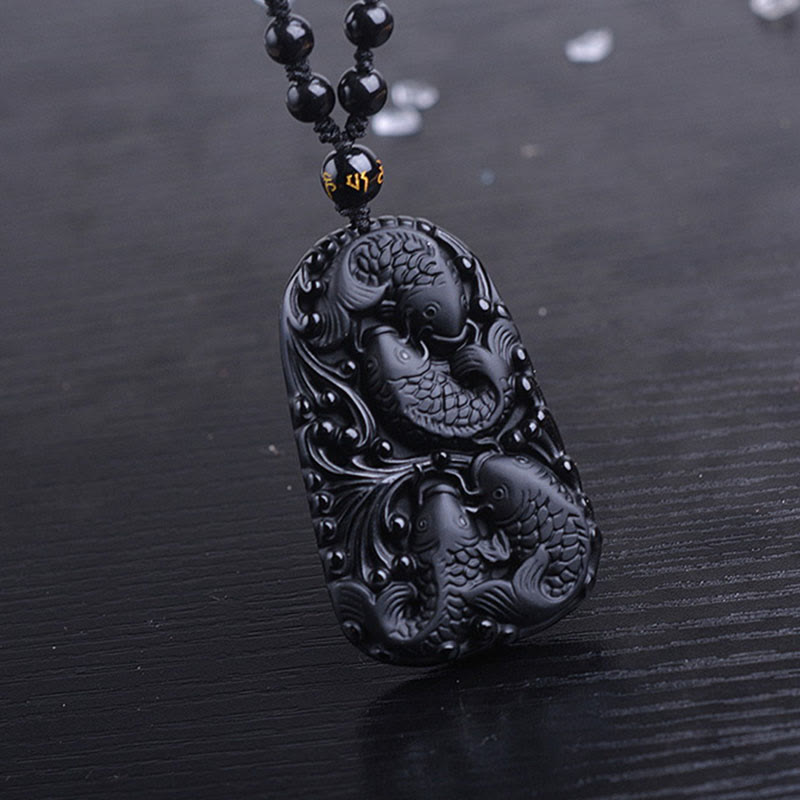 Collana con ciondolo di perline di forza incisa con pesce koi in ossidiana nera Buddha Stones - image 15