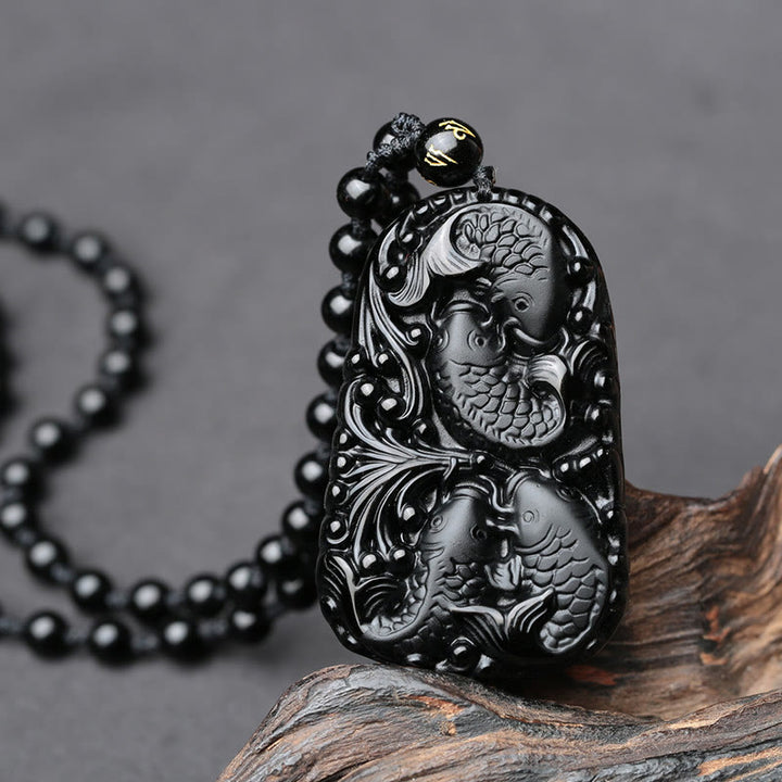 Collana con ciondolo di perline di forza incisa con pesce koi in ossidiana nera Buddha Stones - image 9