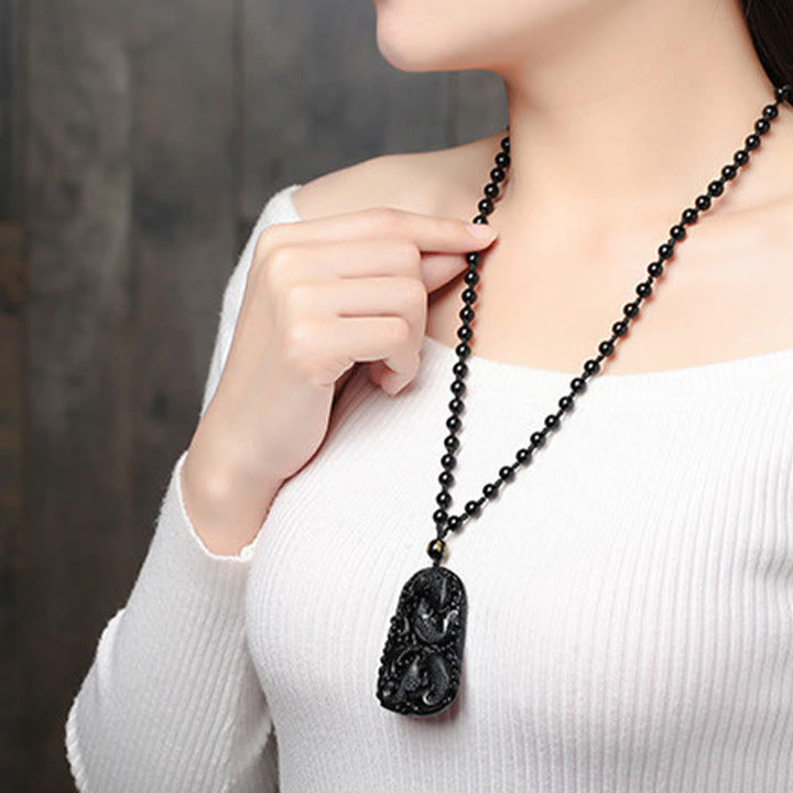 Collana con ciondolo di perline di forza incisa con pesce koi in ossidiana nera Buddha Stones - image 18
