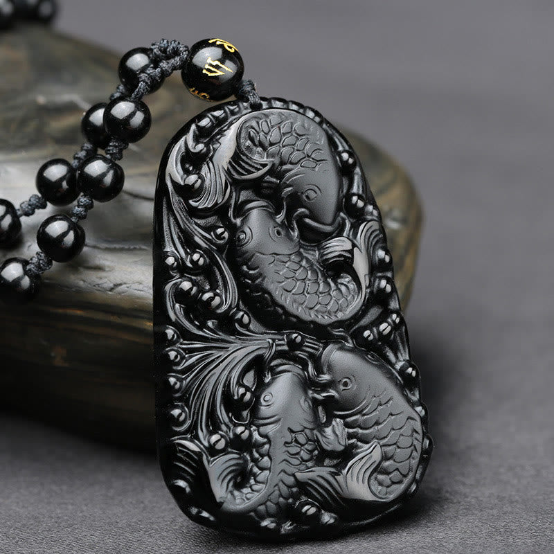 Collana con ciondolo di perline di forza incisa con pesce koi in ossidiana nera Buddha Stones - image 2