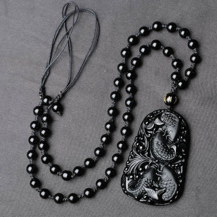 Collana con ciondolo di perline di forza incisa con pesce koi in ossidiana nera Buddha Stones - image 10