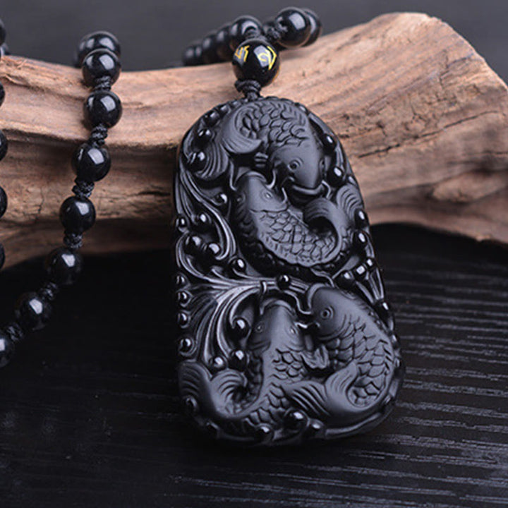 Collana con ciondolo di perline di forza incisa con pesce koi in ossidiana nera Buddha Stones - image 13