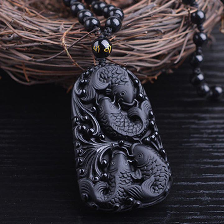 Collana con ciondolo di perline di forza incisa con pesce koi in ossidiana nera Buddha Stones - image 12