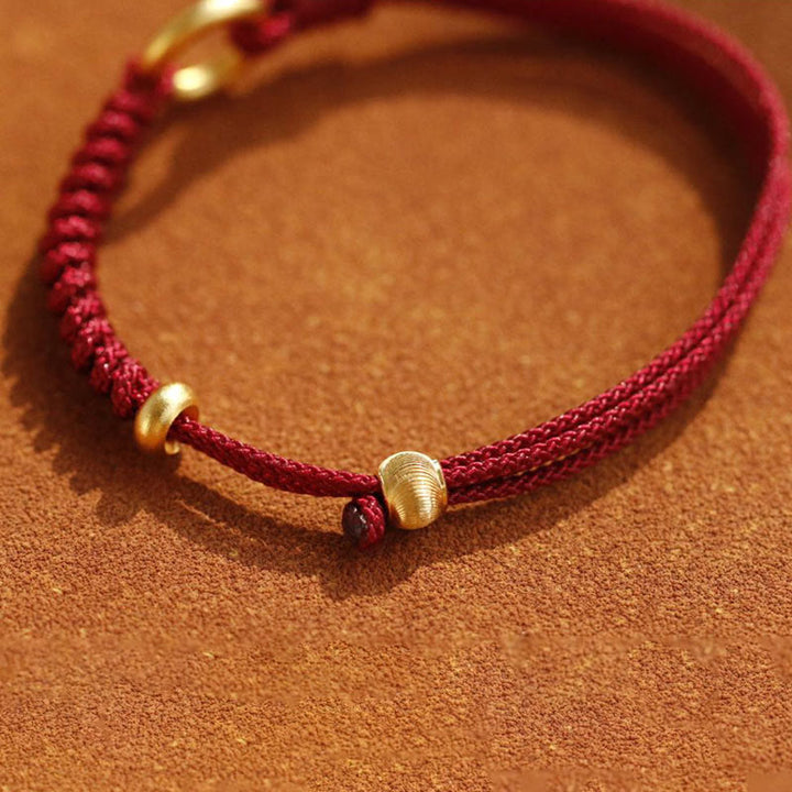 Braccialetto in corda rossa con fibbia della pace in lega Buddha Stones