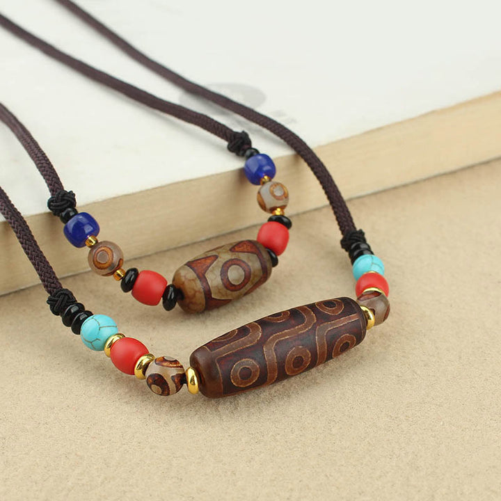 Buddha Stones Tibetano Perlina Dzi a nove occhi Perlina Dzi a tre occhi Corda di protezione Collane Ciondolo