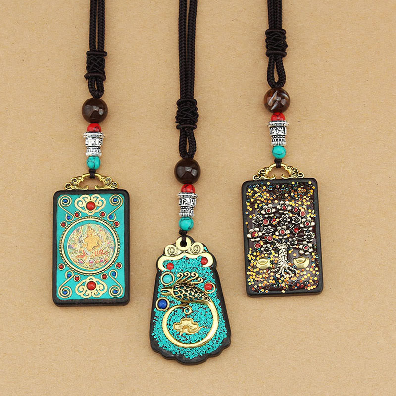 Buddha Stones Tibet Dio della Ricchezza Albero dei Soldi Fenice Dorata Thangka Ebano Collana Pendente della Pace