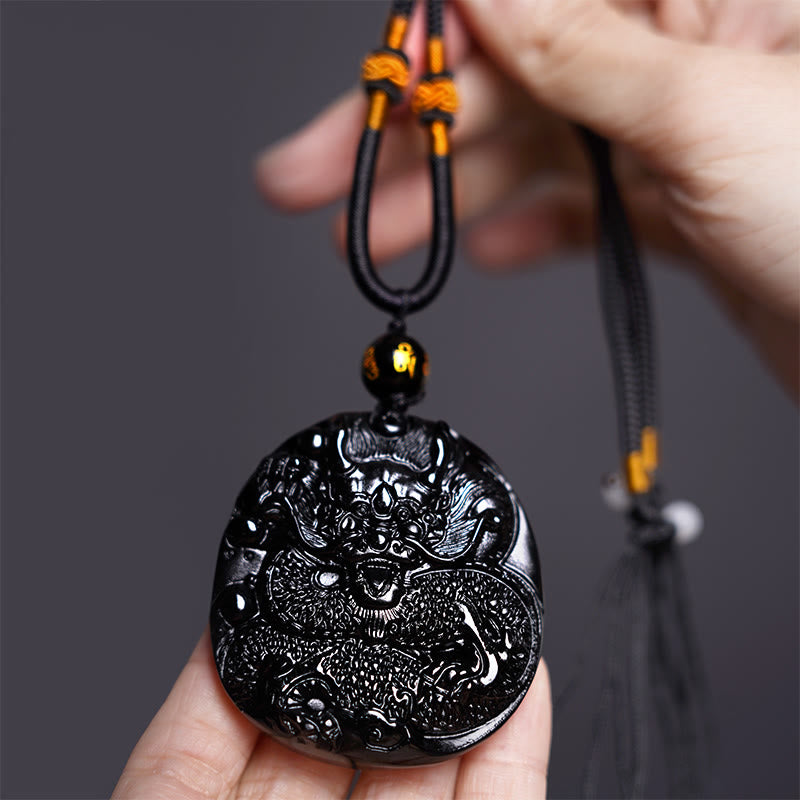 Collana con ciondolo di protezione in ossidiana nera naturale con drago intagliato rotondo in Buddha Stones - image 3