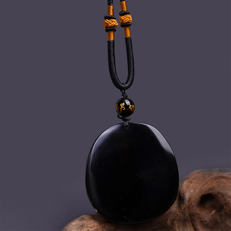 Collana con ciondolo di protezione in ossidiana nera naturale con drago intagliato rotondo in Buddha Stones - image 6