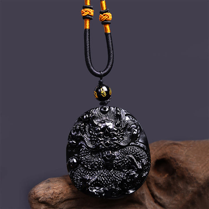 Collana con ciondolo di protezione in ossidiana nera naturale con drago intagliato rotondo in Buddha Stones - image 5