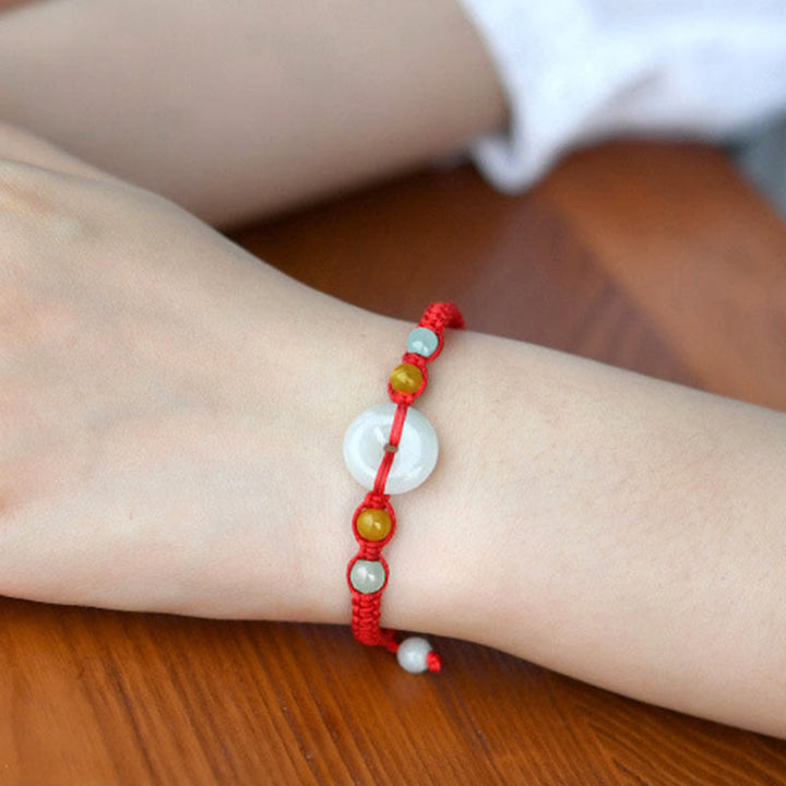 Braccialetto con corda rossa e fibbia della pace in giada con Buddha Stones