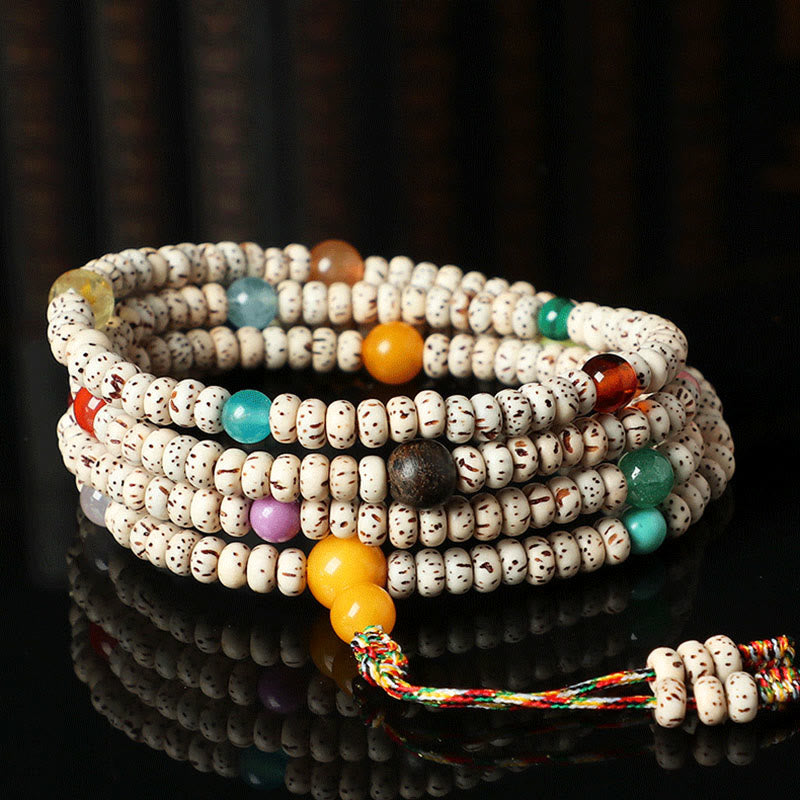 Braccialetto della ricchezza in agata ambrata con semi di Bodhi tibetano e pietre Buddha Stones