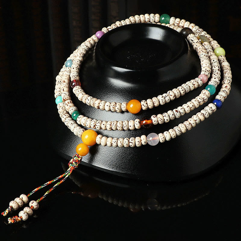 Braccialetto della ricchezza in agata ambrata con semi di Bodhi tibetano e pietre Buddha Stones