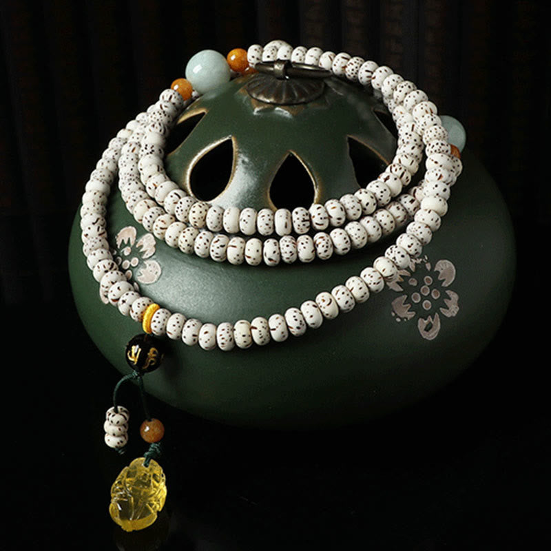 Braccialetto della ricchezza in agata ambrata con semi di Bodhi tibetano e pietre Buddha Stones