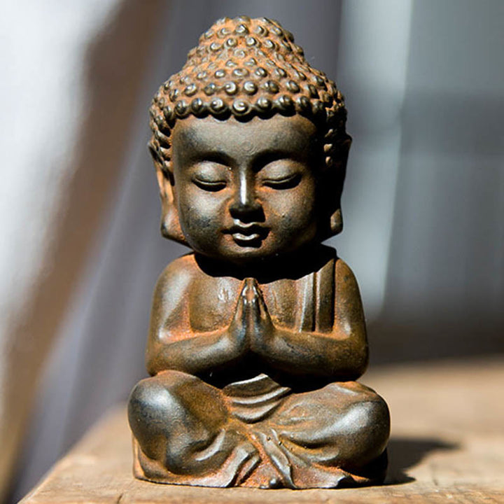Buddha Stones fatte a mano Piccolo Buddha Sakyamuni in polvere di ferro Statua in resina fusa ruggine Decorazione