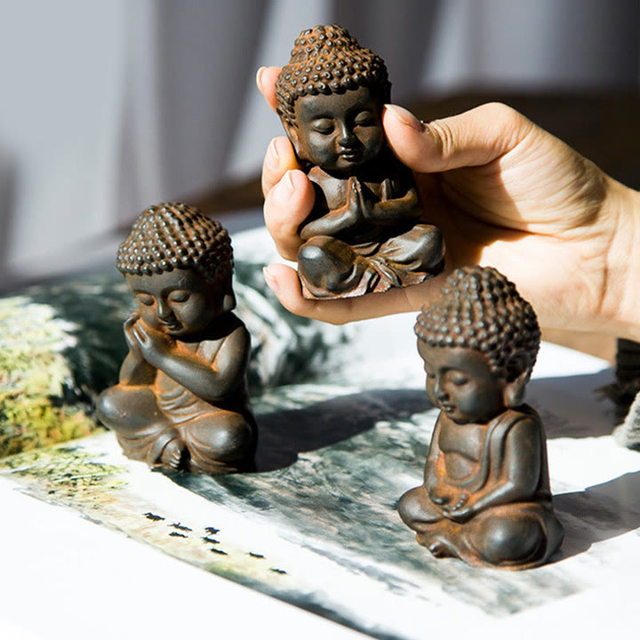 Buddha Stones fatte a mano Piccolo Buddha Sakyamuni in polvere di ferro Statua in resina fusa ruggine Decorazione
