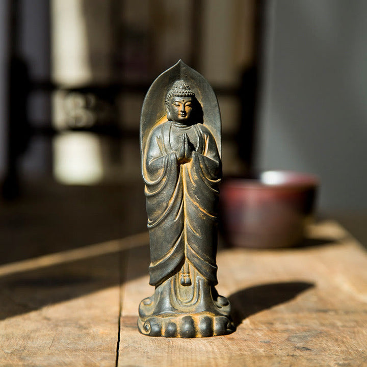 Decorazione della statua in resina colata di polvere di ferro Sakyamuni Buddha Namaste fatta a mano Buddha Stones